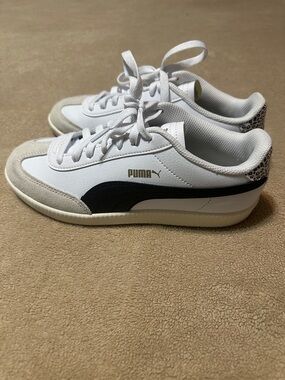 Puma White and Black Low-Top Sneakers with Gold Logo